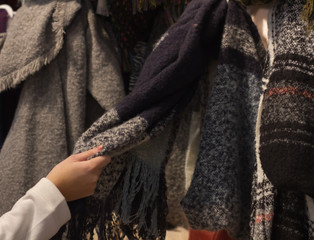 A young woman Shopping a new scarf