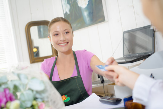 Florist taking a payment