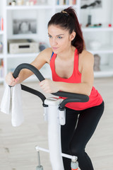 Fototapeta premium young woman on a stepper machine