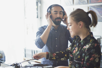 Young couple shopping for records together
