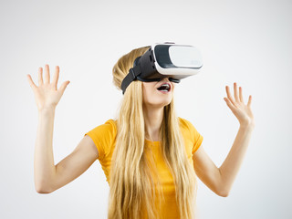 Girl wearing virtual reality goggles.