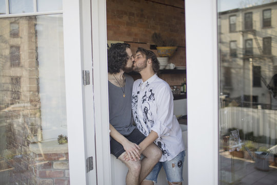 Gay couple kissing
