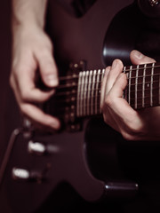 Fototapeta premium Male hands playing electric guitar