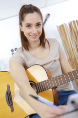 Fototapeta premium woman plays guitar