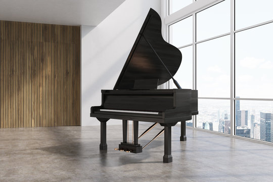 Black piano in a white and wooden room