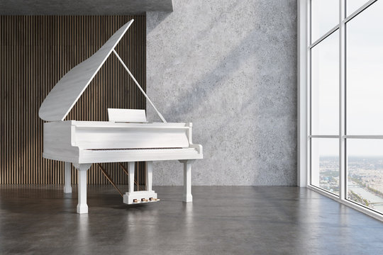 White piano in a concrete and wooden room