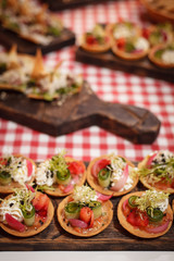 Many different snacks on beautiful boards