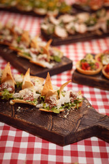 Many different snacks on beautiful boards