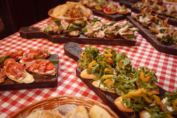 Many different snacks on beautiful boards
