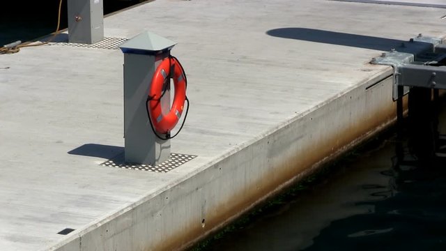 Stern of whale watch boat bilges water while waiting for tourists to depart from Provincetown harbor on hot summers day