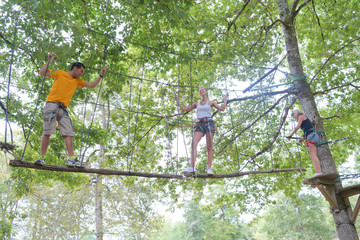 family climbing rope at the adventure park