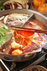  Double flavor hot pot on the table   