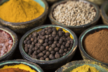 Hot spices in wooden bowls