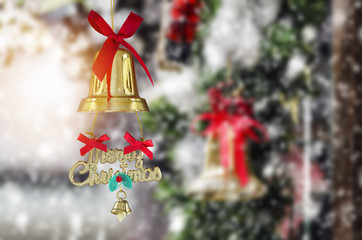 Christmas bell with red ribbon and snowy background