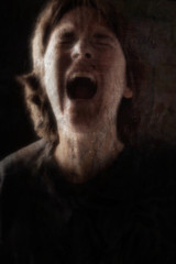 Screaming woman grunge blurred image