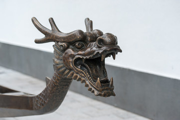 Bronze dragon head at the front of a chinese dragonboat