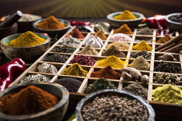 Wooden box with spices and herbs