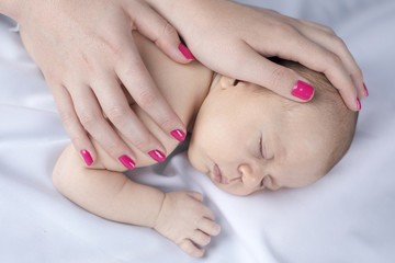 Fototapeta na wymiar Cute newborn baby hand holding mother