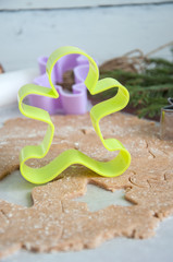 Fototapeta na wymiar Gingerbread batter (dough) with cookie cutters