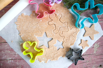 Gingerbread batter (dough) with cookie cutters