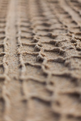 Fototapeta na wymiar Tyre track in sand