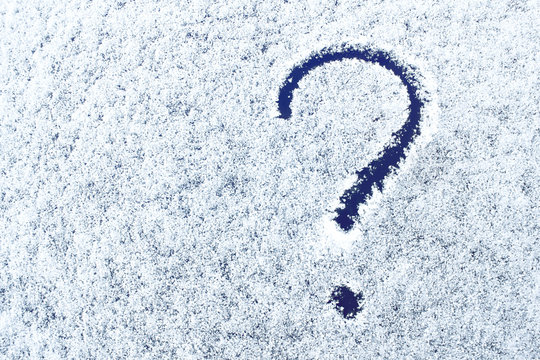 Snow texture with question mark. Picture on the snow surface