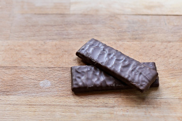 Chocolate / Chocolate bar on wooden background