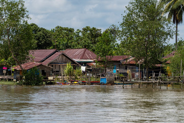 Fototapeta na wymiar Fisherman house on Berau river, Borneo, Kalimantan, Indonesia