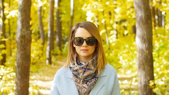 Beautiful fashion woman in autumn park