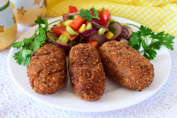 Fish sticks in breadcrumbs coating, deep fried