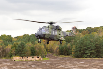 Fototapeta na wymiar german military helicopter in flights over battlefield