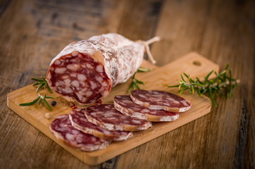 French salami Sausage on a wooden table
