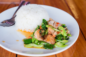 Stir fried kale and crispy pork with rice, Thai food