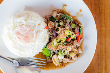 stir-fried pork and herb with rice or stir-fried Jango, Thai food