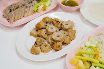 Grilled pork balls serve with fresh vegetables, rice papers, condiments and Peanut Sauce or Nam Neung, Vietnamese Meatball Wraps, Vietnam food, Thai food