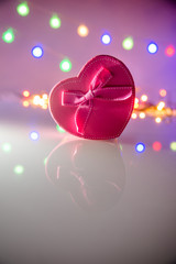 gift box in the form of heart on the background illumination 