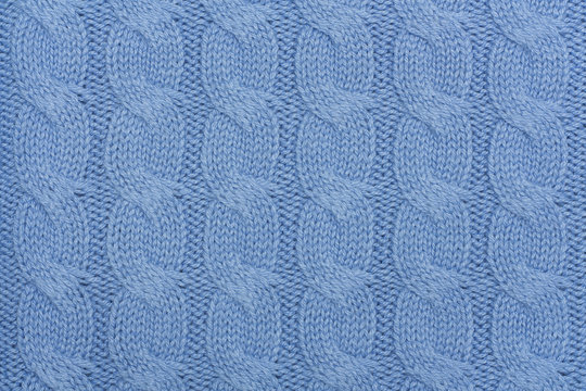 Texture of blue knitted woolen fabric for background