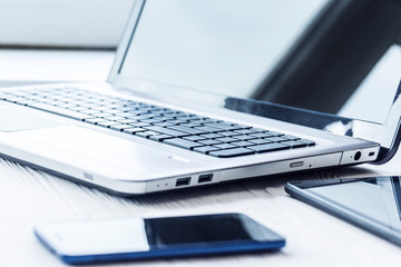 Laptop with tablet and smartphone