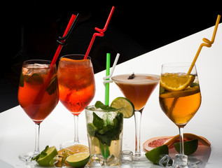 Cocktails on black and white background with mojito.