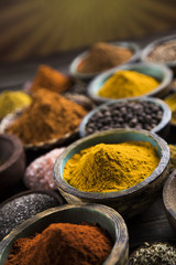 Spices on wooden bowl background 