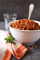 Brown stewed lentils in a bowl