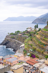 Beautiful view to Manarola mountains, city and a part of sea