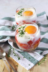 Two verrines breakfast. Eggs, tomatoes and bell pepper