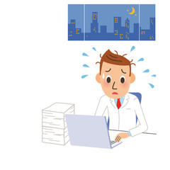 深夜まで働く医者
