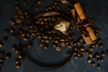 grains of organic coffee with cinnamon and chocolate
