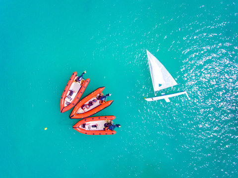 Yachts and resque speed boats ancored in clear blue sea