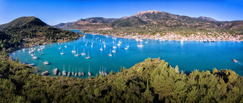 Nydri (Nidri) town in Lefkada Greece Ioanian Island bay panorama yachts and clear blue water in the summer