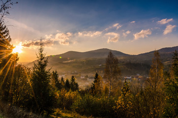 Naklejka na ściany i meble Ukrainian Carpathian Mountains landscape background during the sunset in the autumn season