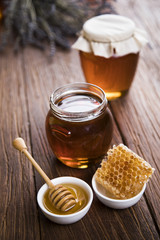 Fresh honey on wooden table