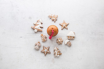 Top of view Christmas Gingerbread and jingle bells on white concrete background